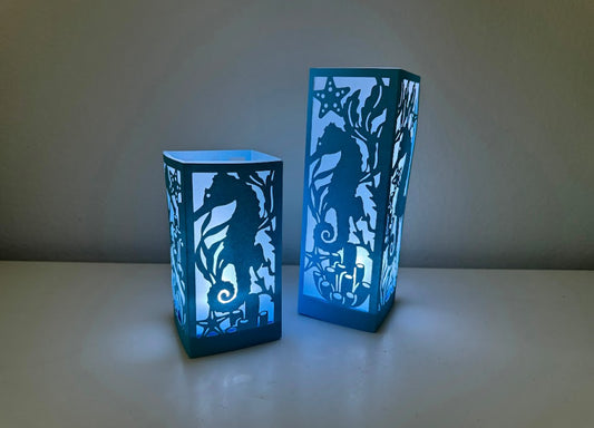 Blue luminary lantern seahorse coastal scene lighted