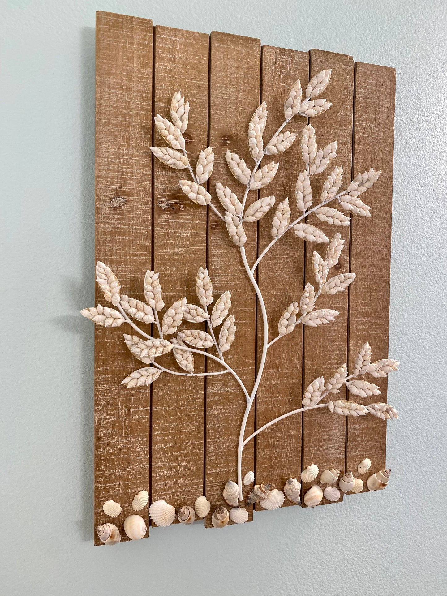 Wall Hanging Wood plank with white metal branches decorated with white shells