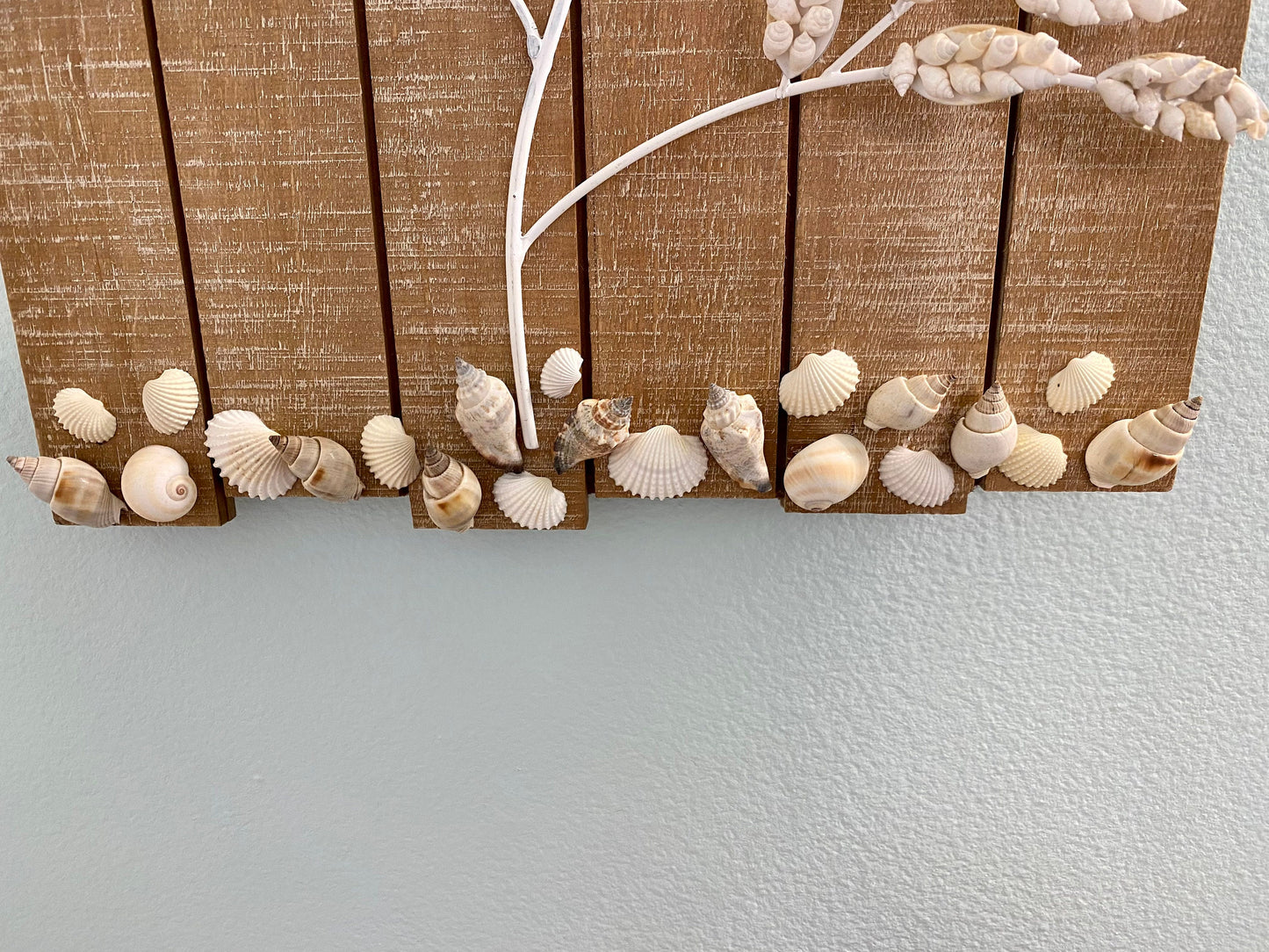 Wall Hanging Wood plank with white metal branches decorated with white shells