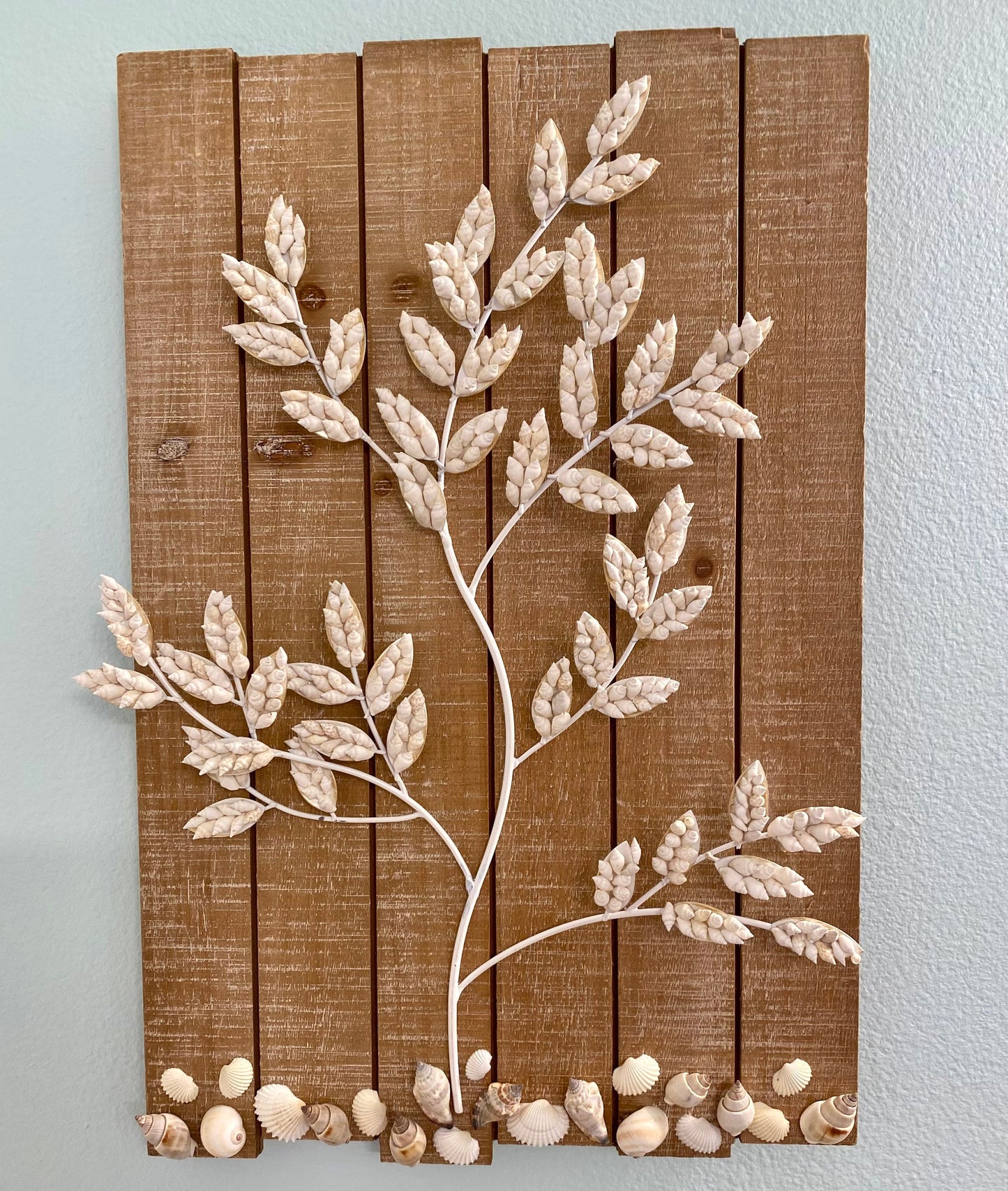 Wall Hanging Wood plank with white metal branches decorated with white shells