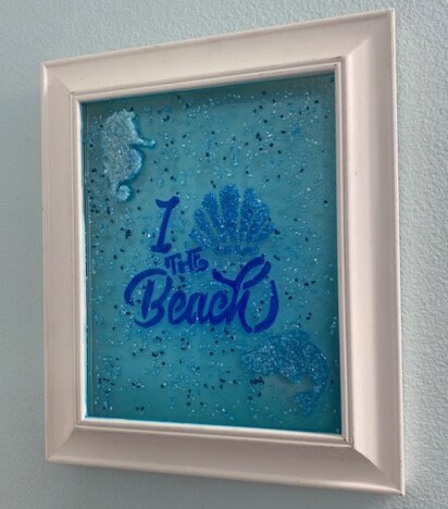 Framed I love the Beach Wall Hanging with shell, seahorse, and dolphin in crushed glass